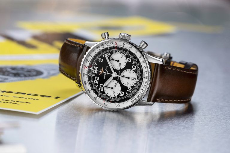 Breitling Navitimer B02 Chronograph 41 Cosmonaute AB0230211B1X1 on its side, crown up